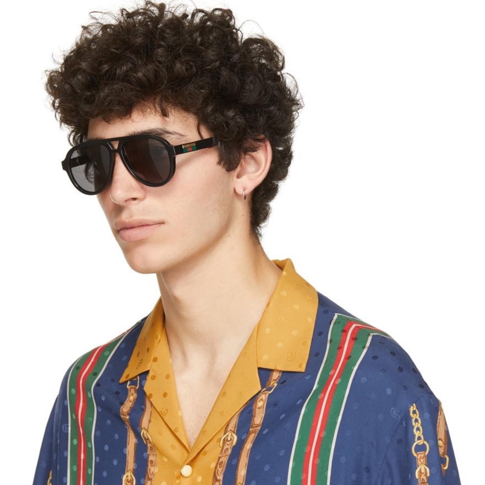 New- GUCCI GG0767S aviator sunglass comes in a shiny black frame with grey le…